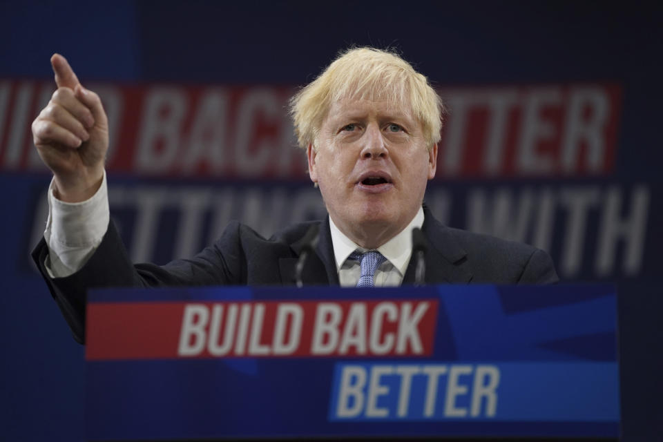 FILE - Britain's Prime Minister Boris Johnson gestures as he makes his keynote speech at the Conservative party conference in Manchester, England, Wednesday, Oct. 6, 2021. When British Prime Minister Boris Johnson survived a no-confidence vote this week, at least one other world leader shared his relief. Ukrainian President Volodymyr Zelenskyy said it was “great news” that “we have not lost a very important ally.” It was a welcome endorsement for a British leader who divides his country, and his party, but has won wide praise as an ally of Ukraine. (AP Photo/Jon Super, File)