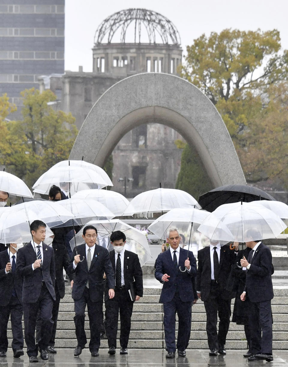 New U.S. Ambassador to Japan Rahm Emanuel, third from right, with Japanese Prime Minister Fumio Kishida, second from left, visits Hiroshima Peace Memorial Park in Hiroshima, Japan, Saturday, March 26, 2022. Kishida escorted U.S. Ambassador Emanuel in his hometown Hiroshima to pay tribute to the 140,000 victims killed by the Aug. 6, 1945 atomic bombing dropped by the United States amid Russia's nuclear threat in its war against Ukraine.(Kyodo News via AP)