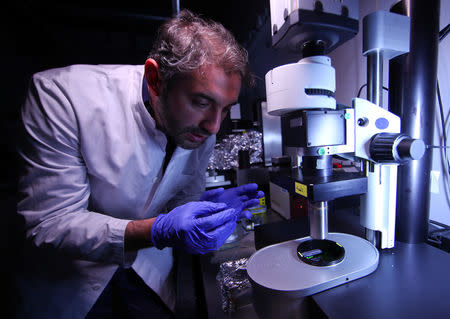 Dr. Ali Ertuerk, Group Leader at the Institute for Stroke and Dementia Research (ISD) at the Ludwig Maximillian's University, works at a laser microscope at his laboratory in Munich, Germany April 23, 2019. Mr. Ertuerk and his team developed DISCO transparency technology which is used by scientists from diverse biomedical research fields to generate high resolution views of intact rodent organs and bodies, a milestone on the way to generate 3D-bioprinted human organs. Picture taken April 23, 2019. REUTERS/Michael Dalder