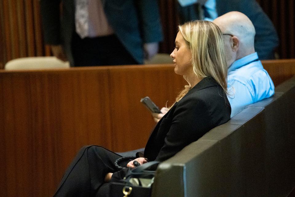 Dr. Katherine Roxanne Grawe, known to her online followers and patients as "Dr. Roxy," sits at a medical board hearing where her license was revoked permanently in July.