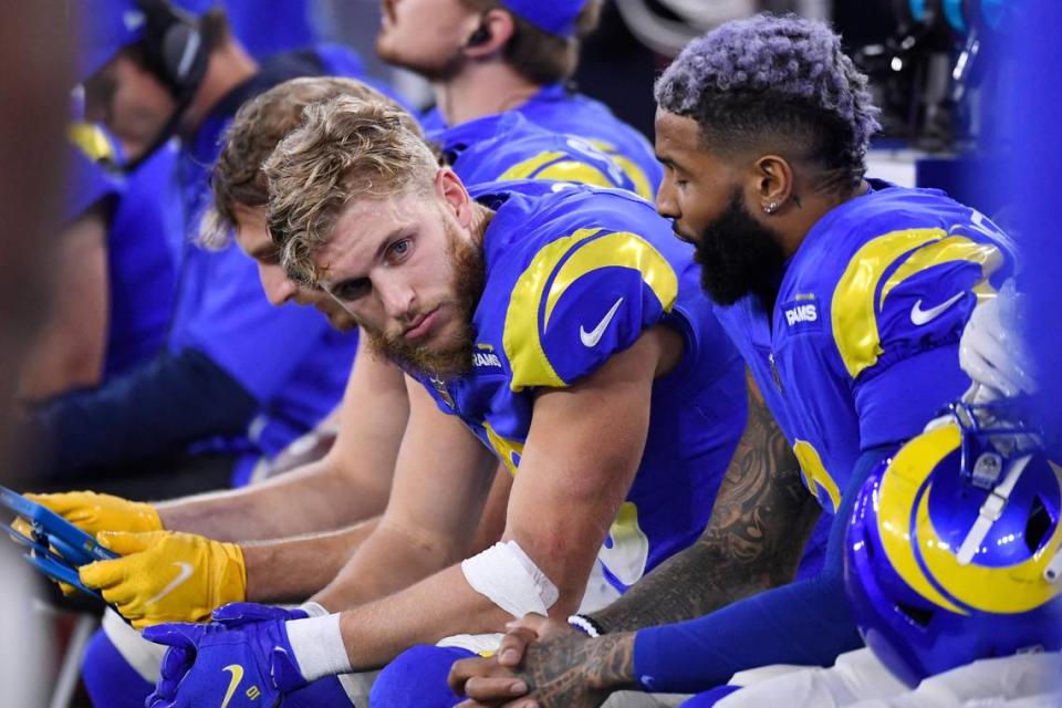 Los Angeles Rams wide receiver Cooper Kupp, center, talks to wide receiver Odell Beckham Jr., right, during the second half of an NFL football game against the Seattle Seahawks Tuesday, Dec. 21, 2021, in Inglewood, Calif. (AP Photo/Kevork Djansezian)