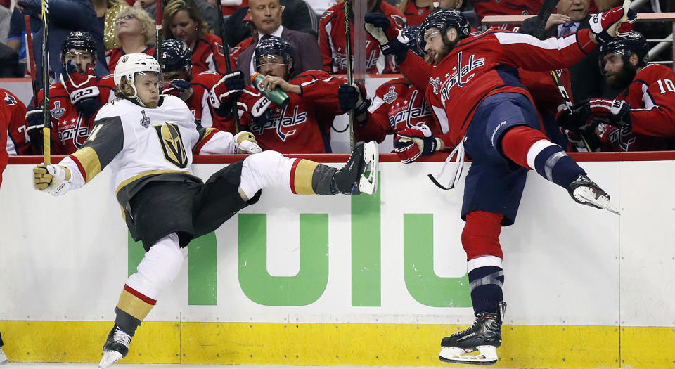 William Karlsson, left, of Sweden, falls to the ice after a hit by Washington Capitals forward Tom Wilson. (Alex Brandon/AP)