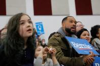 Supporters of U.S. Democratic presidential candidate Bernie Sanders listen to him speak during a rally in Dearborn, Michigan