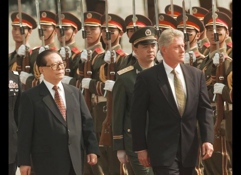 President Clinton and the People's Republic of China President Jiang Zemin review Chinese troops during arrival ceremonies Saturday, June 27, 1998, at east the plaza of the Great Hall of the People in Beijing. 