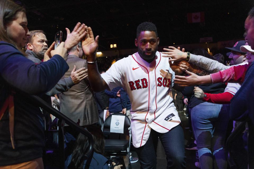 Boston Red Sox center fielder Jackie Bradley Jr. greets fans on his way to the stage during the baseball team's fan fest Friday, Jan. 17, 2020, in Springfield, Mass. (Leon Nguyen/The Republican via AP)