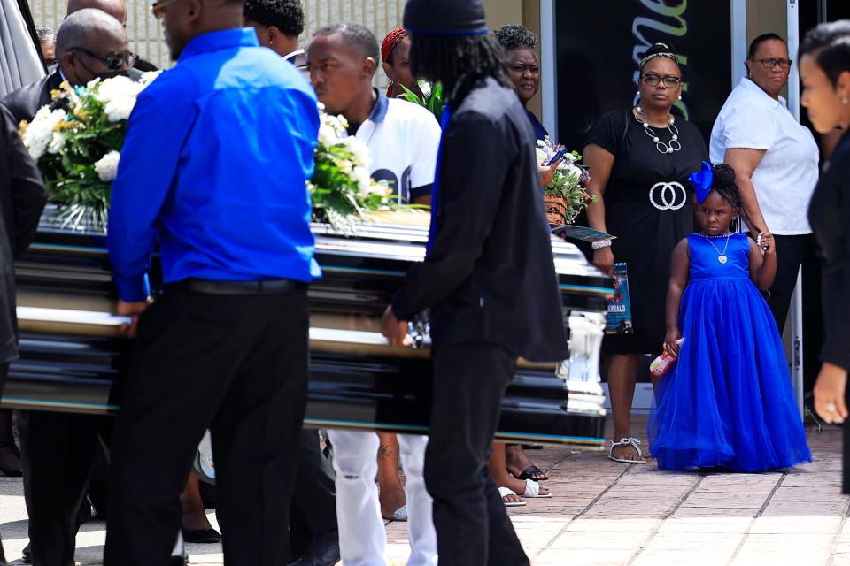 Je Asia, 4, watches the casket of her father, 29-year-old Jerrald De’Shaun Gallion, during funeral services at St. Paul Missionary Baptist Church of Jacksonville. Gallion was one of three victims killed in a racially motivated shooting on Aug. 26, 2023, at a Dollar General store on Kings Road.