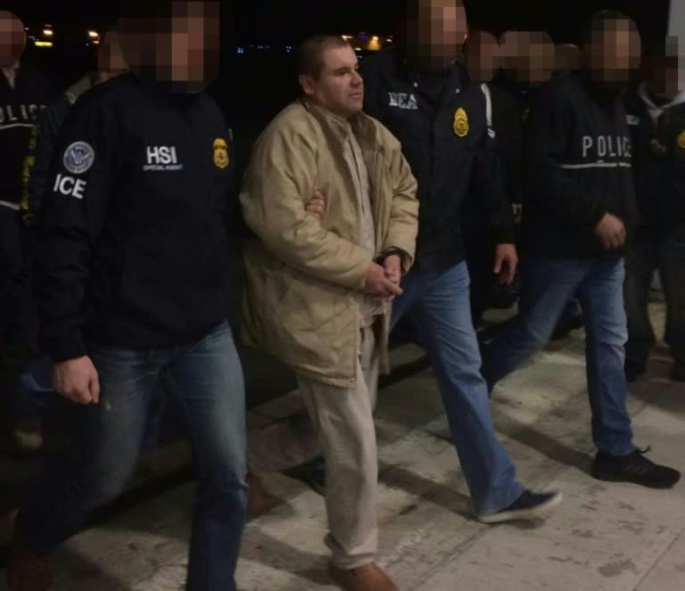 Joaquin Guzman aka "El Chapo" is escorted by Immigration and Customs Enforcement personal as he is extradited to the United States on January 19, 2017, in Ciudad Juarez, Mexico