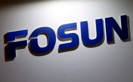 FILE PHOTO: A company logo of Fosun International is seen at the Fosun Fair held alongside the annual general meeting of the Chinese conglomerate in Hong Kong, China May 28, 2015. REUTERS/Bobby Yip/File Photo