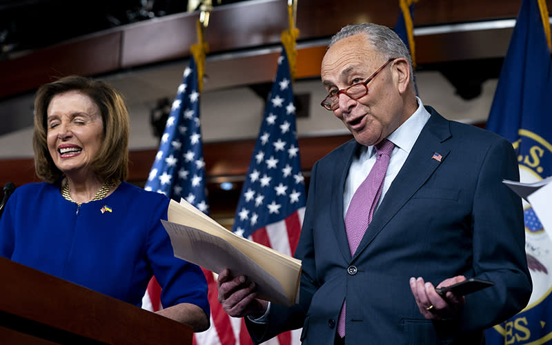 Senate Majority Leader Charles Schumer (D-N.Y.) reacts to Speaker Nancy Pelosi’s (D-Calif.) comment about returning to the House side during a press conference on April 28 to discuss bicameral legislation to lower gas prices. <em>Greg Nash</em>