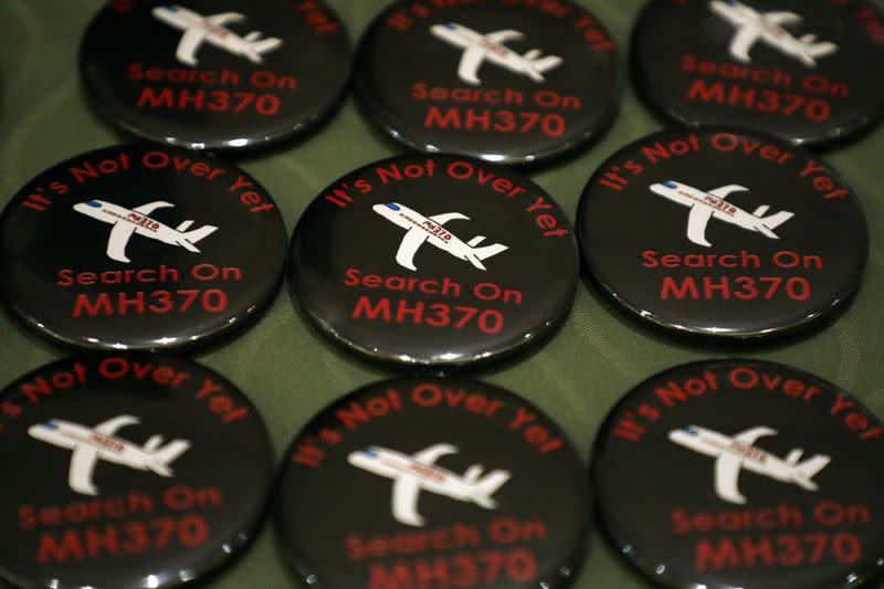 Badges are displayed during the sixth annual remembrance event for the missing Malaysia Airlines flight MH370 in Putrajaya
