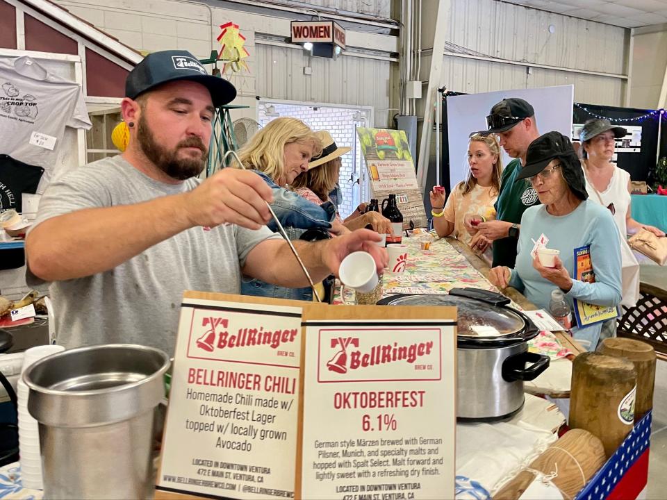 Bellringer Brewing Company's Dan White serves up free samples of the brewery's special chili recipe at the Ventura County Fair on Thursday. Trying samples was one way Star Reporter Isaiah Murtaugh tried to enjoy the fair on the cheap.