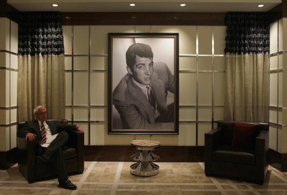 A television reporter sits in the lounge reserved for high-end gamblers during a press tour of the Horseshoe Casino Cleveland in Cleveland on Wednesday, May 9, 2012. The new $350 million casino project is scheduled to open to the public on Monday, May 14. (AP Photo/Amy Sancetta)