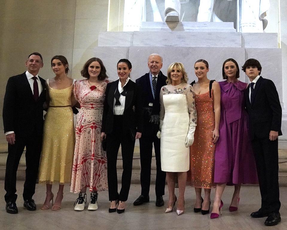 US President Joe Biden and US First Lady Jill Biden pose with their family in front of the statue of Abraham Lincoln at the "Celebrating America" event at the Lincoln Memorial after his inauguration as the 46th President of the United States in Washington, DC, January 20, 2021.