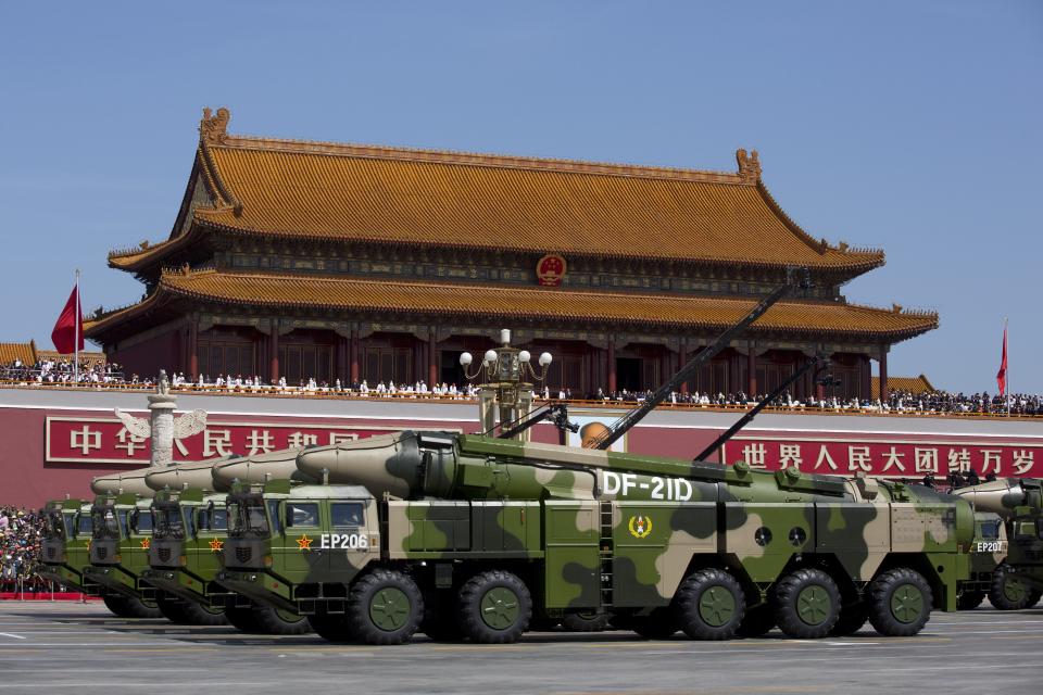 Chinese military vehicles carrying DF-21D anti-ship ballistic missiles, potentially capable of sinking a U.S. Nimitz-class aircraft carrier in a single strike, drive past the Tiananmen Gate during a military parade to mark the 70th anniversary of the end of World War Two on September 3, 2015, in Beijing, China.