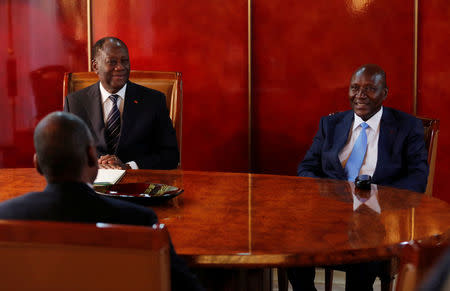 Ivory Coast's President Alassane Ouattara (L), vice-president Daniel Kablan Duncan (R) and the new Prime Minister Amadou Gon Coulibaly attend a meeting in the Presidential Palace in Abidjan, Ivory Coast January 10, 2017. REUTERS/Thierry Gouegnon