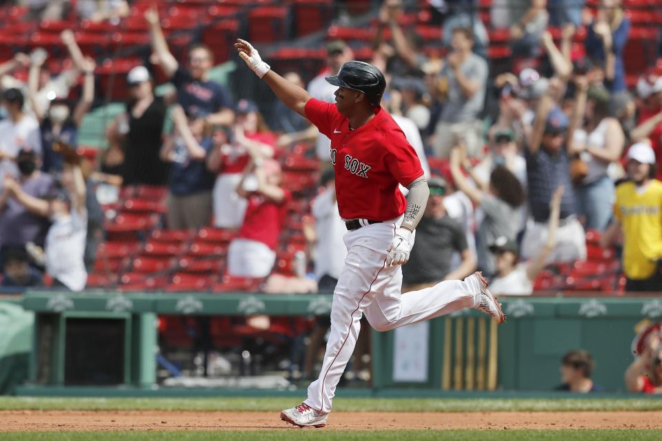 Boston Red Sox's Rafael Devers rounds the bases on his three-run home run during the fifth inning of a baseball game against the Los Angeles Angels, Sunday, May 16, 2021, in Boston. (AP Photo/Michael Dwyer)