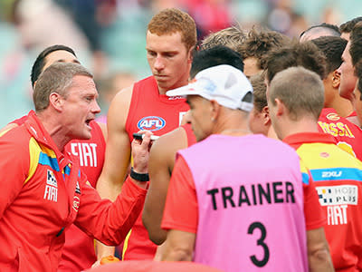 Gold Coast coach Guy McKenna tries to inspire his troops against Melbourne