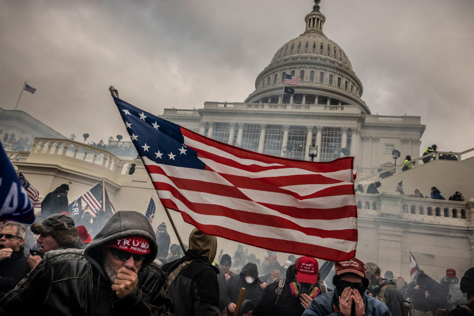 Supporters of President Trump who are trying to overturn the results of the 2020 presidential election clash with police, as the crowd storms up the west side steps of the U.S. Capitol, on Jan. 6, 2021.<span class="copyright">David Butow—Redux</span>