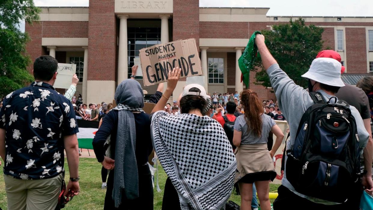 PHOTO: Pro-Palestinian demonstrators hold signs protesting the Israel-Hamas war in addition to calling on the University of Mississippi to stop doing business with Israel or companies they say support the war in Gaza, May 2, 2024, in Oxford, Miss. (Antonella Rescigno/The Daily Mississippian via AP)