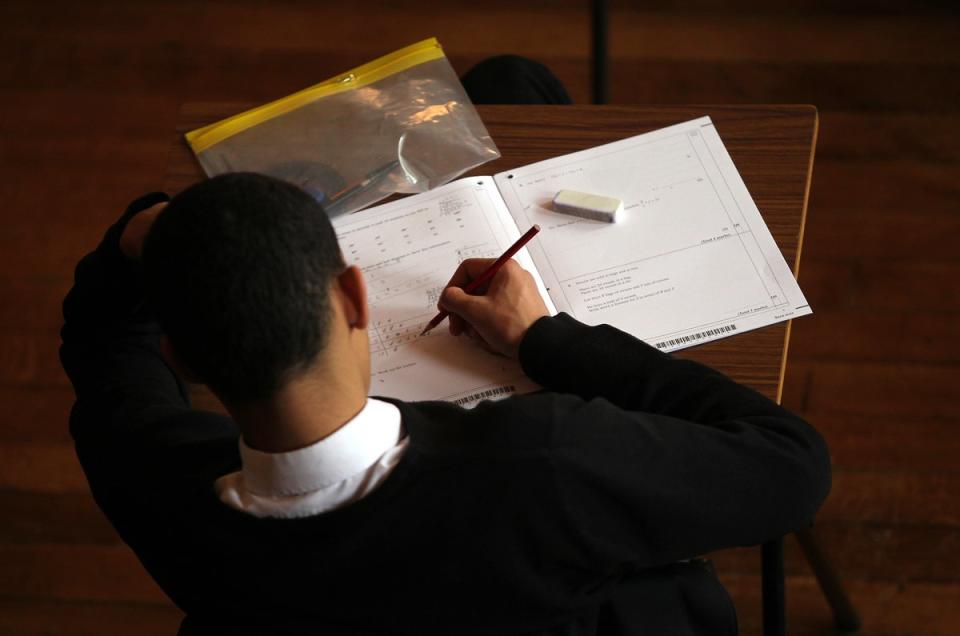 A student doing an exam (David Davies/PA) (PA Archive)