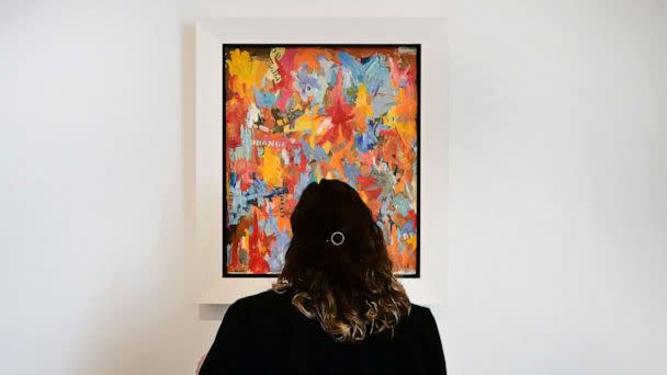PHOTO: A woman views 'Small False Start' by Jasper Johns on display at Christie's Los Angeles on October 12, 2022 in Beverly Hills, California during the media preview of 'Visionary: The Paul Allen Collection.' (Frederic J. Brown/AFP via Getty Images)