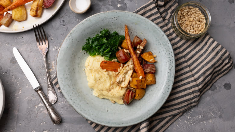 roasted root vegetable polenta on blue plate