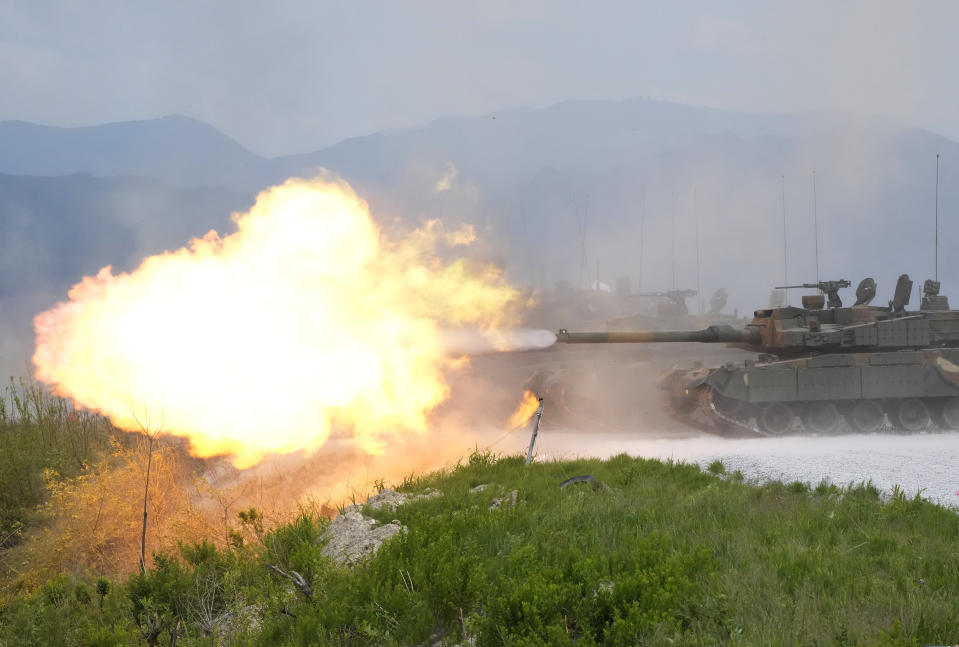 The South Korean army's K-2 tank fires during South Korea-U.S. joint military drills at Seungjin Fire Training Field in Pocheon, South Korea, Thursday, May 25, 2023. The South Korean and U.S. militaries held massive live-fire drills near the border with North Korea on Thursday, despite the North's warning that it won't tolerate what it calls such a hostile invasion rehearsal on its doorstep. (AP Photo/Ahn Young-joon)