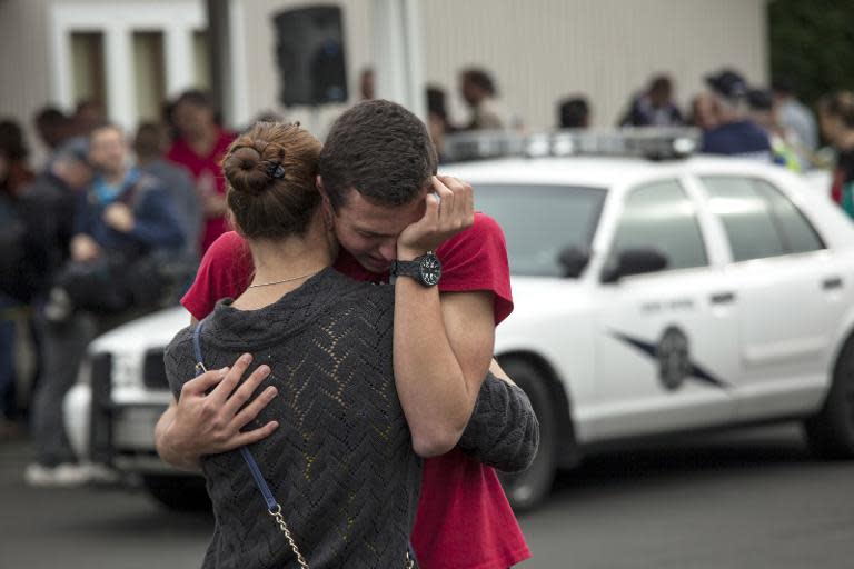 A student embraces a family member at Shoultes Christian Assembly after being evacuated from Marysville-Pilchuck High School in the aftermath of a shooting on the high school's campus on October 24, 2014 in Marysville, Washington