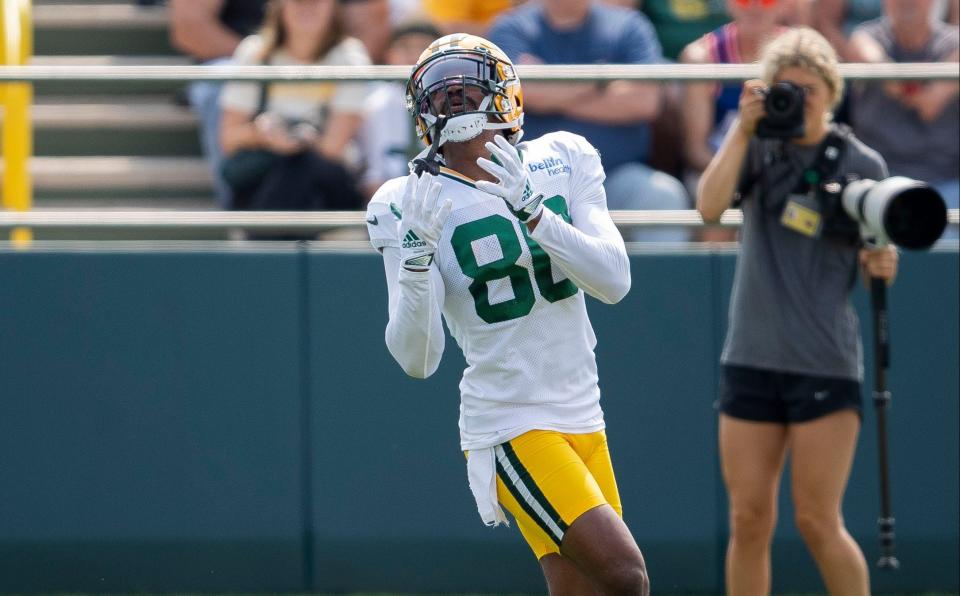 Green Bay Packers wide receiver <a class="link " href="https://sports.yahoo.com/nfl/players/34185" data-i13n="sec:content-canvas;subsec:anchor_text;elm:context_link" data-ylk="slk:Bo Melton;sec:content-canvas;subsec:anchor_text;elm:context_link;itc:0">Bo Melton</a> makes a catch during practice on Monday, July 31, 2023, at Ray Nitschke Field in Green Bay, Wis.
