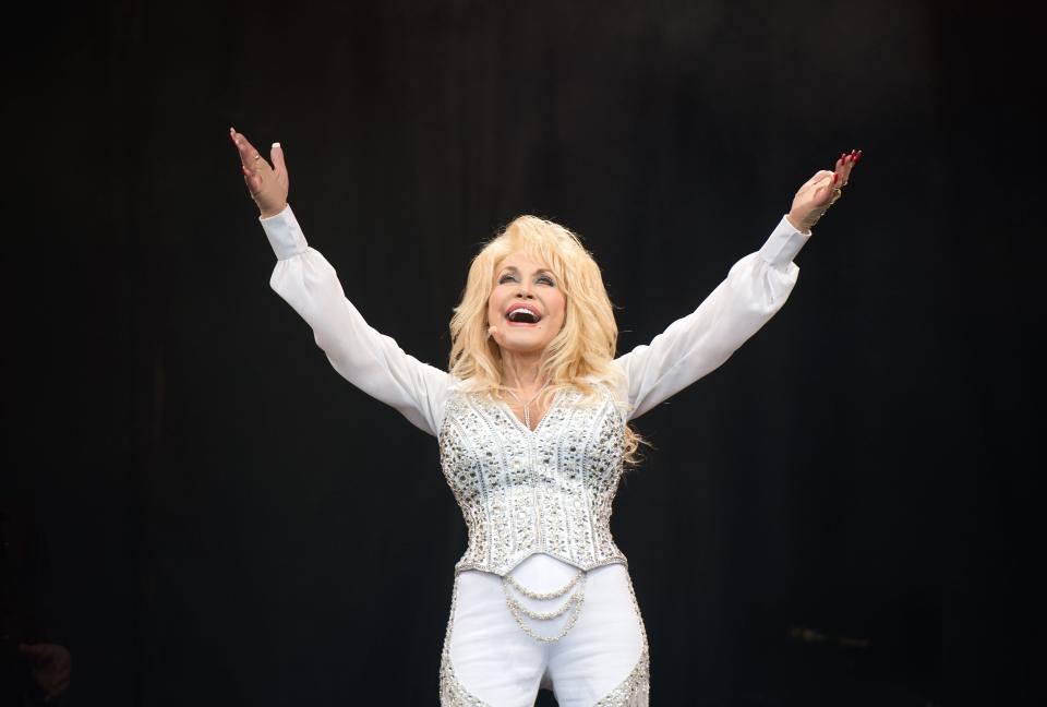 GLASTONBURY, ENGLAND - JUNE 29:  Dolly Parton performs on the Pyramid Stage on Day 3 of the Glastonbury Festival at Worthy Farm on June 29, 2014 in Glastonbury, England.  (Photo by Samir Hussein/Redferns via Getty Images)