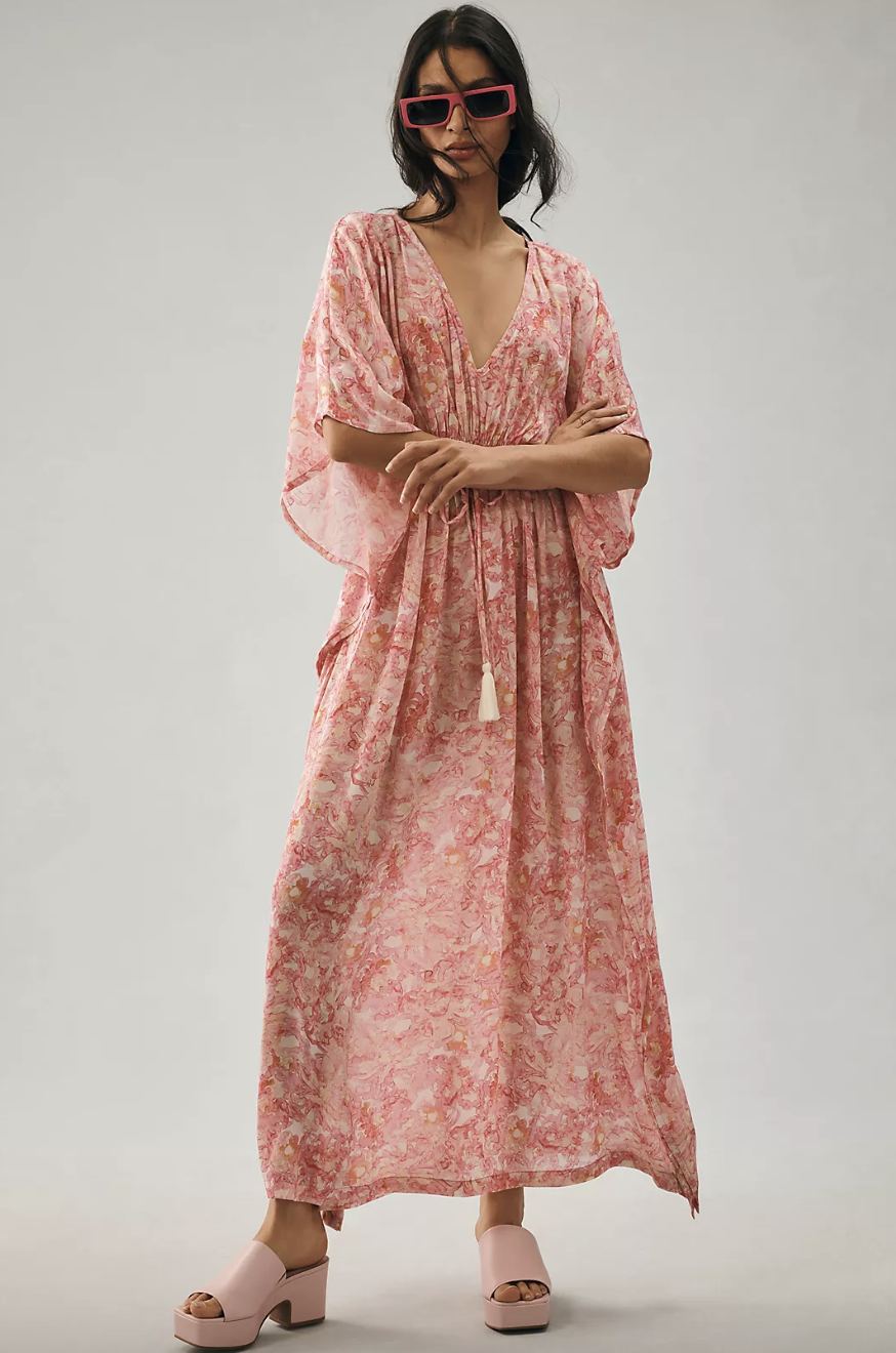 brunette model wearing pink Rujuta Sheth Floral Kaftan (photo via Anthropologie) 