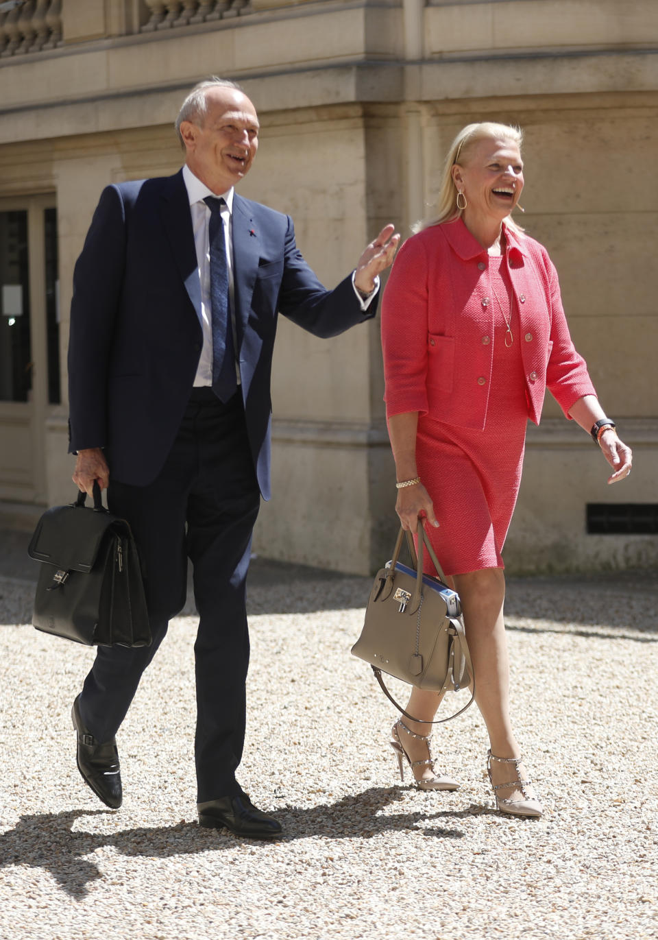 IBM CEO Virginia Rometty, right, and French cosmetics giant L'Oreal CEO Jean-Paul Agon arrive for the Tech for Good summit, Wednesday, May 15, 2019 in Paris. World leaders and tech bosses meet Wednesday in Paris to discuss ways to prevent social media from spreading deadly ideas. (AP Photo/Thibault Camus)