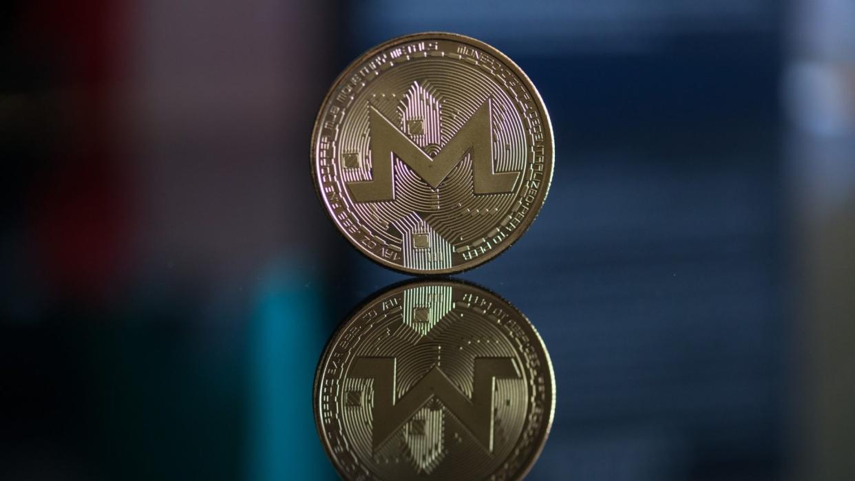 Nitra, Slovakia, march 4, 2018: Monero cryptocurrency coin with reflection.