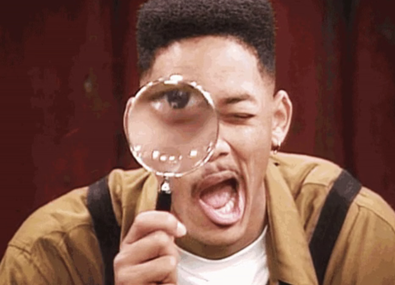 Will Smith on "The Fresh Prince of Bel-Air" looking through a magnifying glass