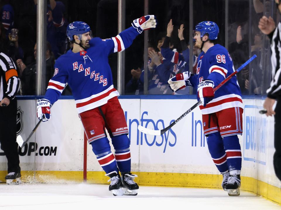 NEW YORK, NEW YORK - APRIL 15: Jack Roslovic #96 of the New York Rangers (R) celebrates his first period goal against the Ottawa Senators and is joined by Chris Kreider #20 (L) at Madison Square Garden on April 15, 2024 in New York City.