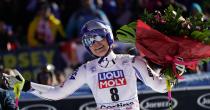 FILE - In this Sunday, Jan. 20, 2019 filer, United States' Lindsey Vonn holds a bunch of flowers after completing an alpine ski, women's World Cup super-G in Cortina D'Ampezzo, Italy. Lindsey Vonn has only two races remaining on her aching knees. The women's all-time leader in World Cup wins announced Friday, Feb. 1, 2019 that she will retire from ski racing after this month's world championships in Sweden. The 34-year-old Vonn had been planning to retire in December but changed her plans because of persistent pain in both of her knees, which she fully realized after failing to finish a race in Cortina d'Ampezzo, Italy, last month. (AP Photo/Giovanni Auletta, File )