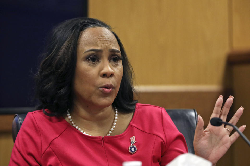 Fulton County District Attorney Fani Willis testifies during a hearing on the Georgia election interference case, Thursday, Feb. 15, 2024, in Atlanta. The hearing is to determine whether Willis should be removed from the case because of a relationship with Nathan Wade, special prosecutor she hired in the election interference case against former President Donald Trump. (Alyssa Pointer/Pool Photo via AP)