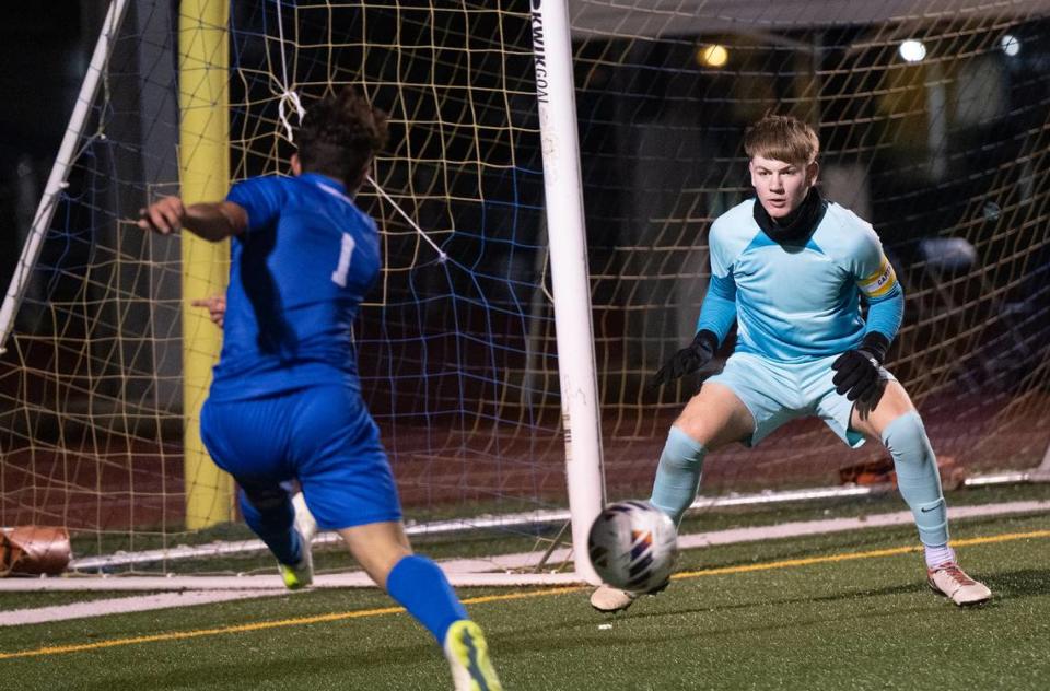 Enochs goalkeeper Haidyn Stevens defends the goal asTurlock’s Kurtis Silveira takes a shot during the Central California Athletic League game at Turlock High School in Turlock, Calif., Wednesday, Jan. 24, 2024.