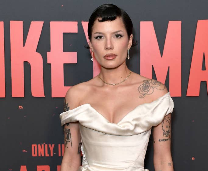 Halsey wearing an off-the-shoulder satin mini dress at a red carpet event