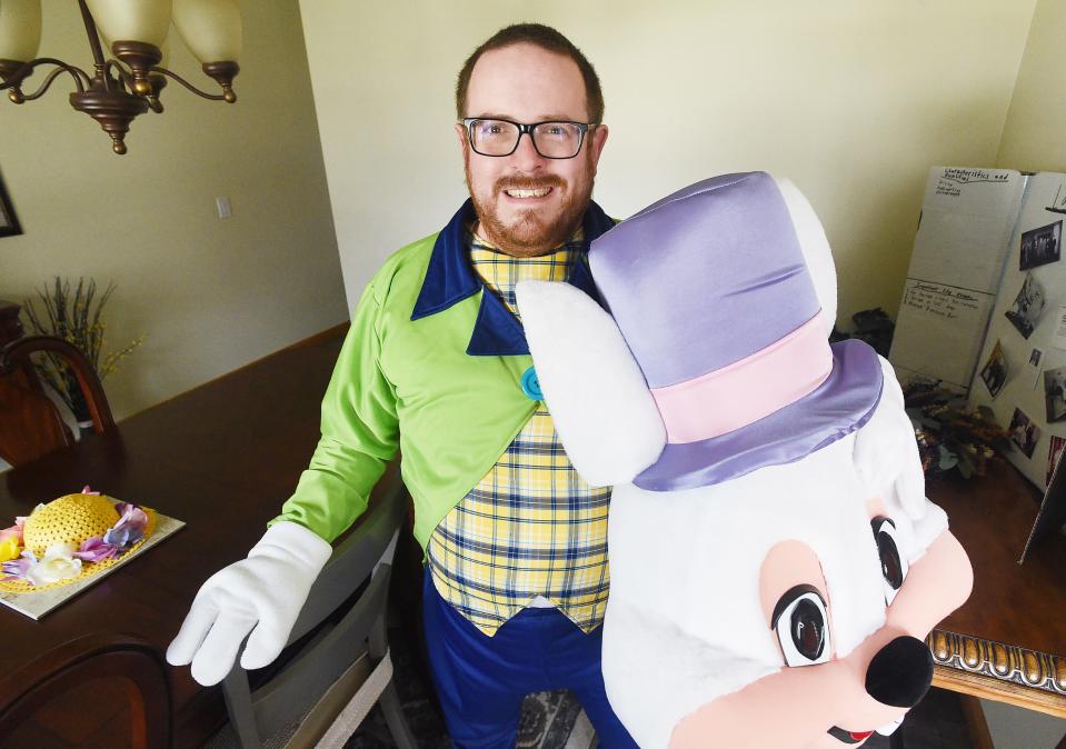 Joe Bell, 40, relaxes after portraying the Easter Bunny for a group of children.