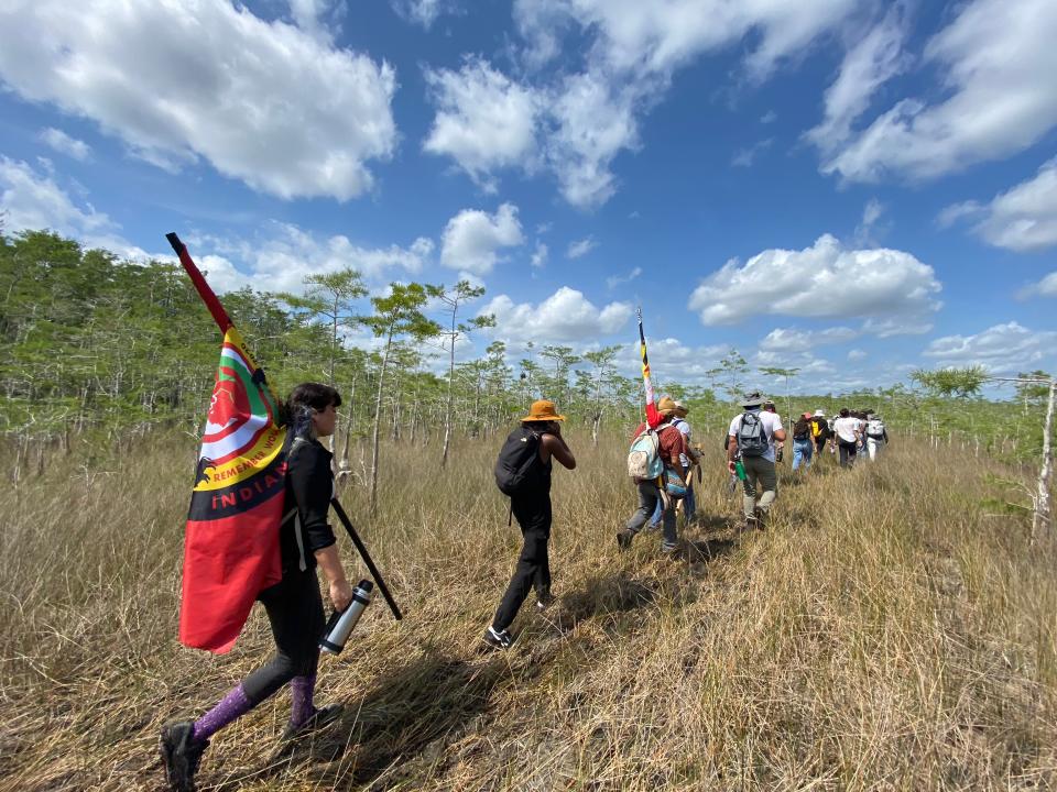 Betty Osceola leads a group of concerned citizens and Miccosukee and Seminole tribe members on a hike through Big Cypress National Preserve on Saturday, April 10, 2021. The group is unhappy about a proposed oil drilling site in the preserve.