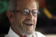 FILE - This Sept. 17, 2012 file photo shows author Elmore Leonard, 86, smiling during an interview at his Bloomfield Township, Mich., home. Leonard, winner this year of an honorary National Book Award, is 87 and says the prize inspired him to write more novels. (AP Photo/Paul Sancya, file)