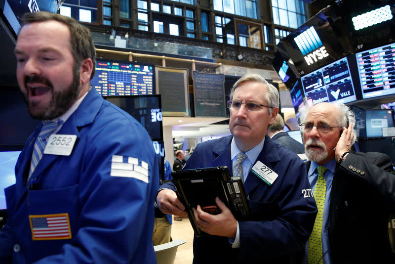 Traders work on the floor of the New York Stock Exchange (NYSE) in New York City, U.S., January 23, 2017. REUTERS/Brendan McDermid