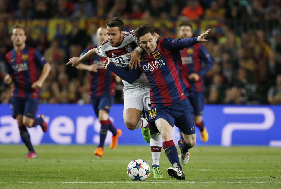 Football: Barcelona's Lionel Messi in action with Bayern Munich's Juan Bernat