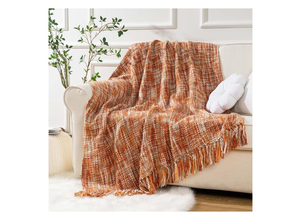 Wrap yourself up in warm luxury with this soft throw blanket. (Source: Amazon)