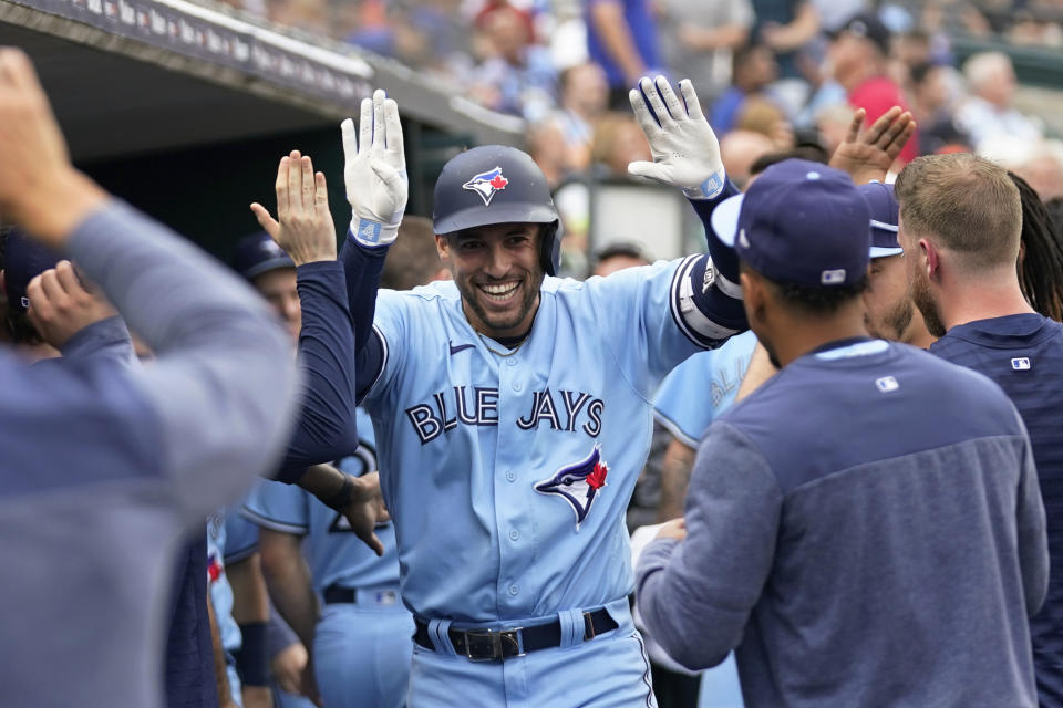 Toronto Blue Jays' George Springer celebrates his two-run home run against the Detroit Tigers in the fourth inning of a baseball game, Friday, July 7, 2023, in Detroit. (AP Photo/Paul Sancya)
