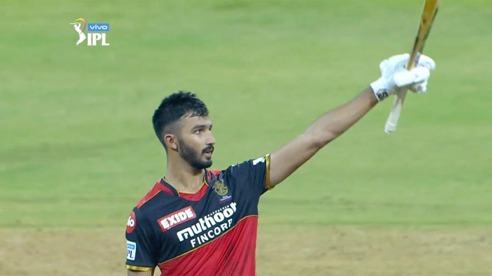 Seen here, Devdutt Padikkal raises his bat after a superb maiden IPL century.