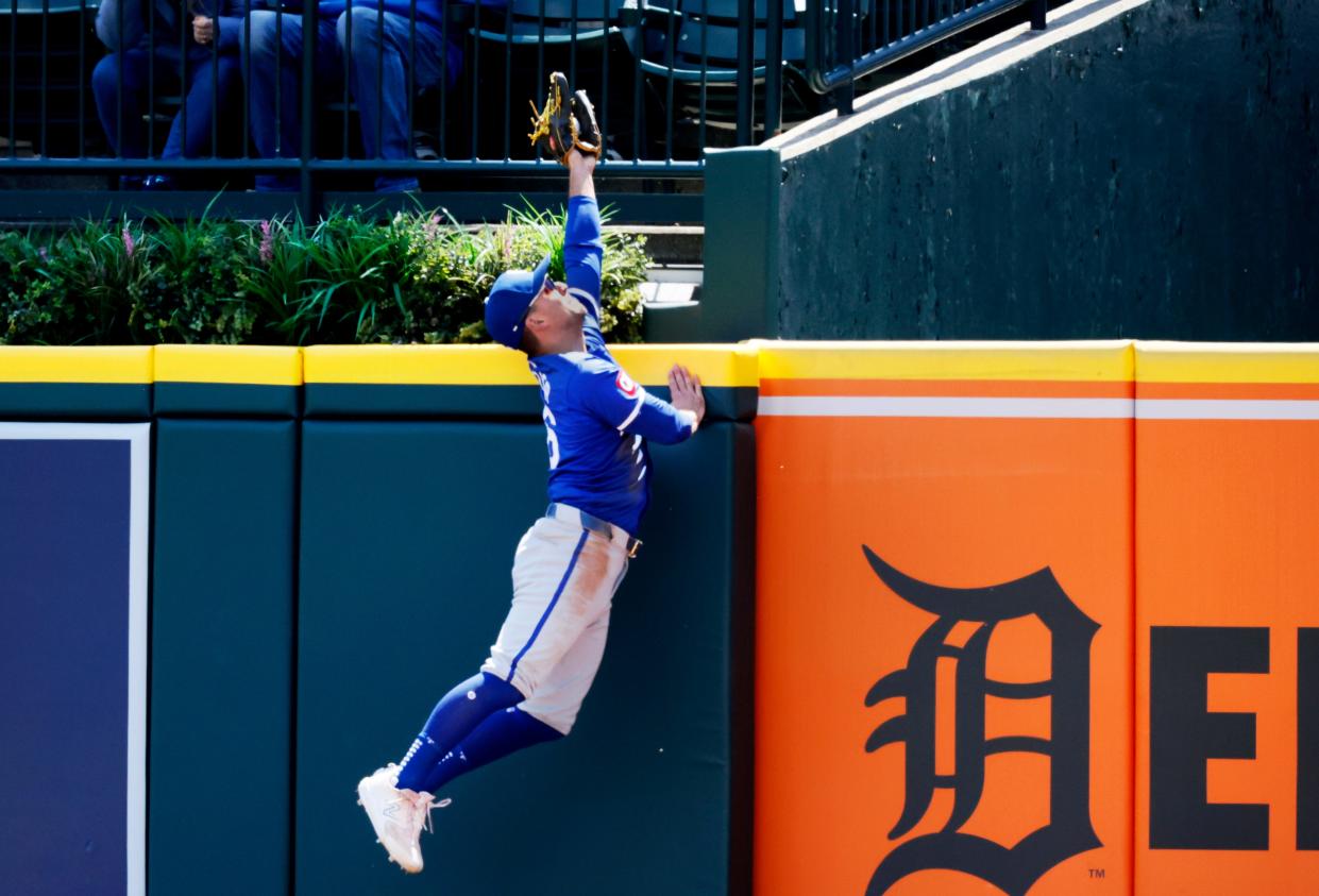 Right fielder Adam Frazier of the Kansas City Royals makes a leaping catch to steal a home run from Parker Meadows of the Detroit Tigers during the third inning at Comerica Park on April 26, 2024 in Detroit.