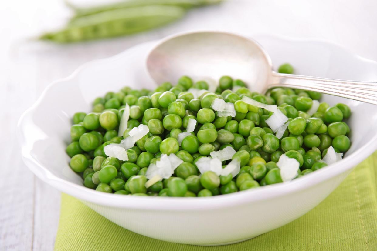 bowl of pea salad and onion