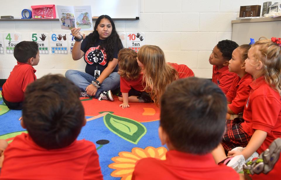 Dreamers Academy kindergarden teacher Fany Benitez reads a story in English to her students in the dual immersion classroom. 